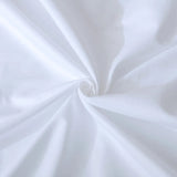 A close-up showcases the smooth, slightly glossy finish of Linenly’s Luxe Cotton Sateen Flat Sheet in white, with soft folds highlighting its luxurious 500 thread count long staple cotton and sateen weave.