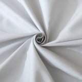 A close-up of silver Luxe Cotton Sateen Pillowcase Set by Linenly, featuring light gray fabric twisted into a spiral pattern that highlights its soft folds and luxurious texture.